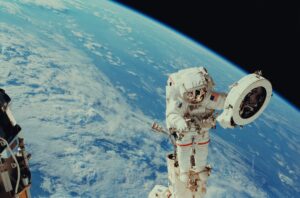OMEGA Watch Repair, a spaceman wearing an OMEGA watch in space.  He's from New York, originally.